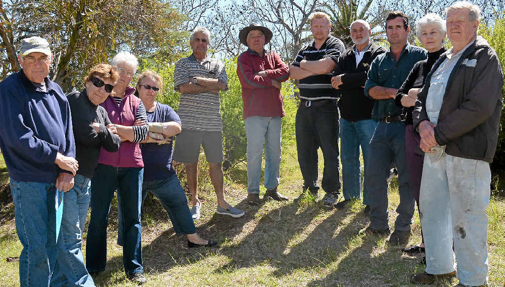 NO WAY WE PAY: Rosenthal Heights residents (from left) John Devitt, Kate Keogh, Margaret Collins, Anna Jackson, Graham Swain, Allan Smith, Brian Nothdurft, Brian Cooper, Keith Mauch, Raylene Swain and Bob Keogh are appalled after receiving supplementary rates notices of up to $1000 from Council. NO WAY WE PAY: Rosenthal Heights residents (from left) John Devitt, Kate Keogh, Margaret Collins, Anna Jackson, Graham Swain, Allan Smith, Brian Nothdurft, Brian Cooper, Keith Mauch, Raylene Swain and Bob Keogh are appalled after receiving supplementary rates notices of up to $1000 from Council.
